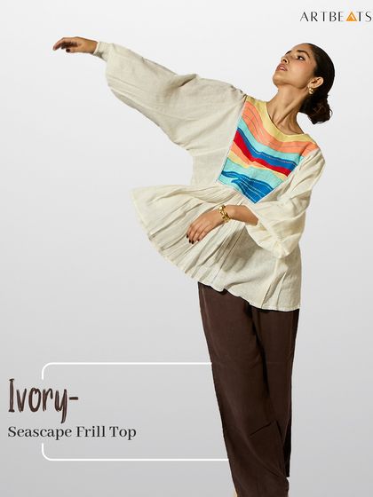 The Ivory Seascape Frill Top. This piece, with its flowing sleeves and colorful art panel, is a perfect example of my palette of the season: soft, natural, and joyful.