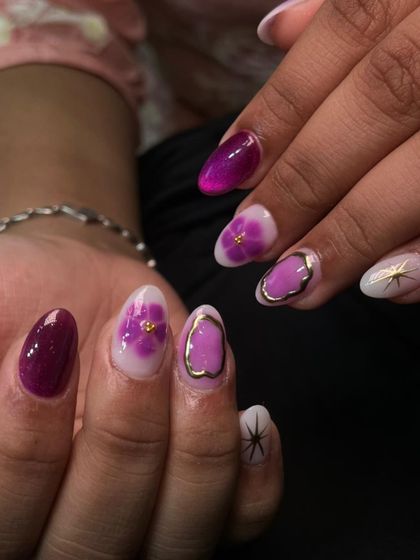 A close-up of the delicate, hand-painted flowers and gold details in this unique festive set.