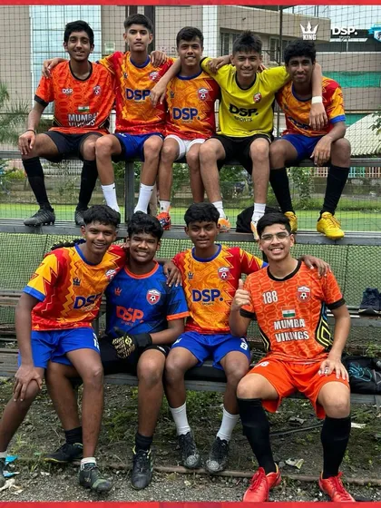 Before the victory, there's the vibe. The team relaxing on the bench, united in their colors and their goal.