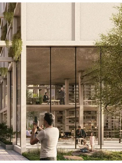A resident captures a moment in the beautifully landscaped grounds of Pixel Housing, a project designed to be both photogenic and livable.