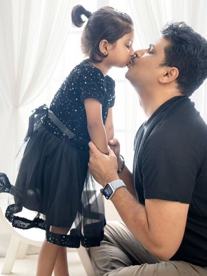 An adorable moment as a daughter gives her dad a kiss on the nose. These are the precious, unscripted moments that I love to capture.