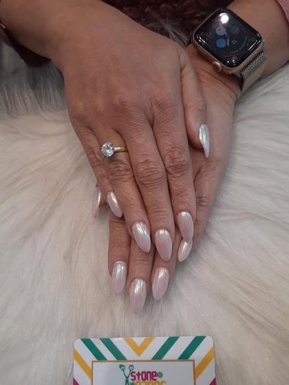 Another example of the stunning pearl chrome effect, this time on longer stiletto nails. The high-shine, pearly finish is elegant, classy, and catches the light beautifully.
