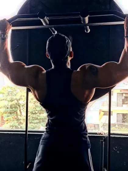The most important element for success is self-confidence. Back double bicep pose.