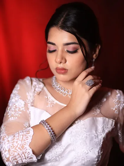A soft and gentle pose, showing the beautiful blend of the eyeshadow and the overall radiant finish of the skin.