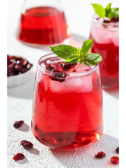 A refreshing cranberry iced tea, shot for US Cranberries India. I used hard light to create sharp shadows and highlight the clarity of the liquid, the ice, and the fresh mint garnish, making it ideal for beverage advertising.