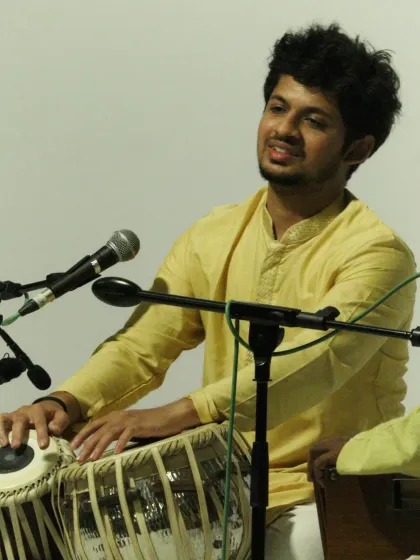 A moment of connection with the audience during a solo piece. The energy exchanged during a live concert is a vital part of the performance.