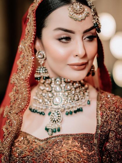 A close-up portrait of the bride, her eyes and jewellery telling a story of elegance.