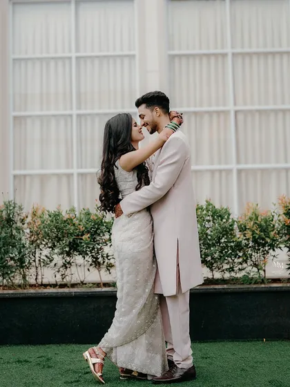 A full-length portrait showcasing the couple's elegant pre-wedding attire and their comfortable, loving posture. This is a classic shot for any pre-wedding album.
