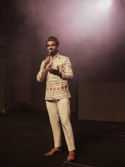 A shot of me on stage, setting the mood with some opening remarks. The right start is key to a successful and energetic evening.