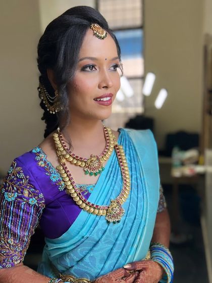 Anusha looking stunning and ready for her ceremony. The makeup is flawless and enhances her beautiful features.