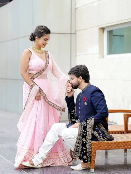A chivalrous gesture that speaks of love and respect. These romantic poses make for timeless and heartwarming pre-wedding photographs.