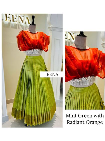A contemporary twist on traditional wear. This ensemble pairs a mint green pleated lehenga with a radiant orange organza blouse, featuring a unique smocked waist detail for a modern silhouette.