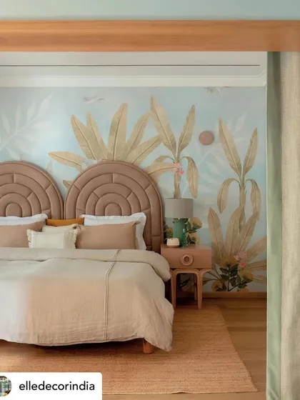 The kids' suite in 'Summer Haus' is a world of enchantment. A custom wallpaper by Kalakaari Haath creates a whimsical, tropical backdrop for the arched headboards, designing a space that sparks imagination and stands the test of time.
