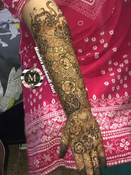 Another angle of a stunning bridal arm piece. Notice how the different elements like flowers, paisleys, and shading come together.