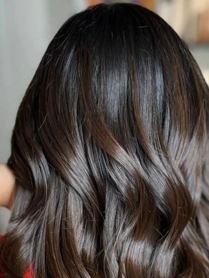 A close-up of the rich balayage, showing the healthy shine and texture.