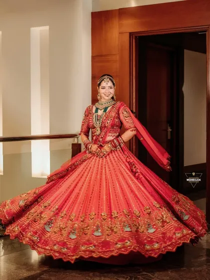 A portrait of pure bridal elegance. I create timeless, magazine-style portraits that let the bride's personality and the beauty of her traditional red lehenga shine.