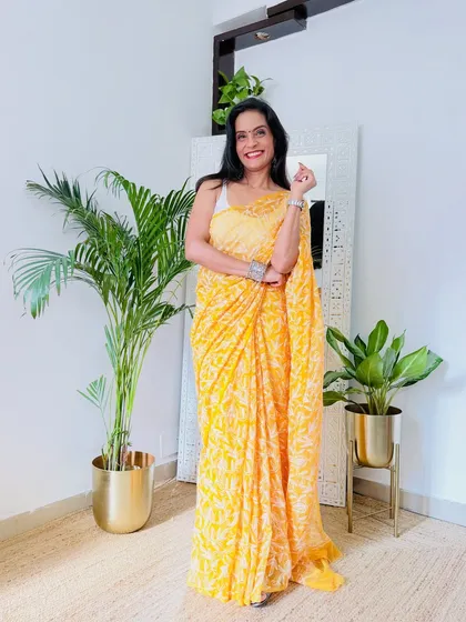 This yellow Chikankari saree is so bright and cheerful. It's a perfect choice for a summer festive occasion or a daytime event.