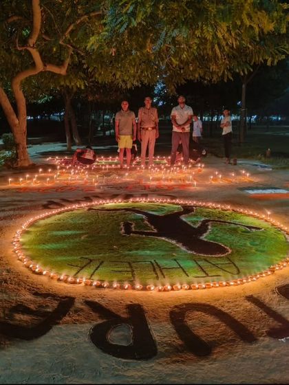The full team of young athletes standing proud with our Diwali creation.