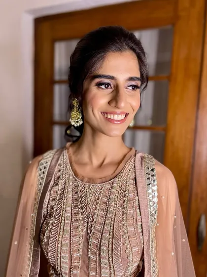 A bright, happy smile from this client. The soft glam makeup enhances her features and gives her a confident glow.