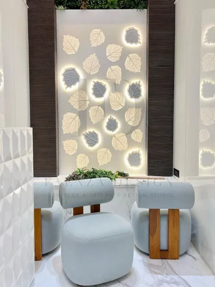 This shows custom-designed low seating for a serene home mandir. The chairs, upholstered in a light blue fabric with solid wood bases, are crafted to be both beautiful and appropriate for a sacred space.