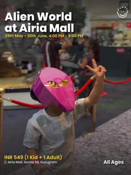 A child in a cool alien mask at the Alien World event, showing the immersive fun.