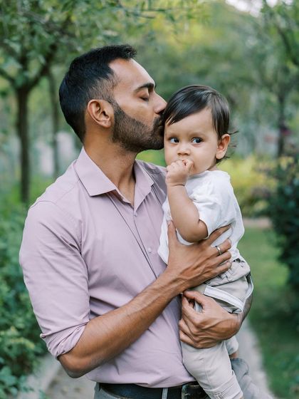 A father holding his son, a quiet and tender moment between them. These are the precious connections I look for.