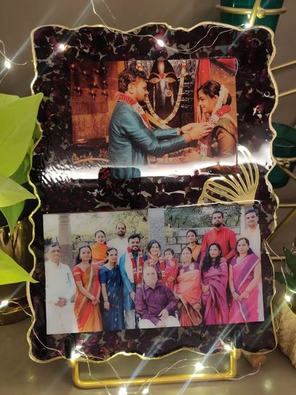 For this custom resin frame, I used the couple's varmala flowers to create a rich, dark border around their favorite wedding and family photos. The added fairy lights make it glow.