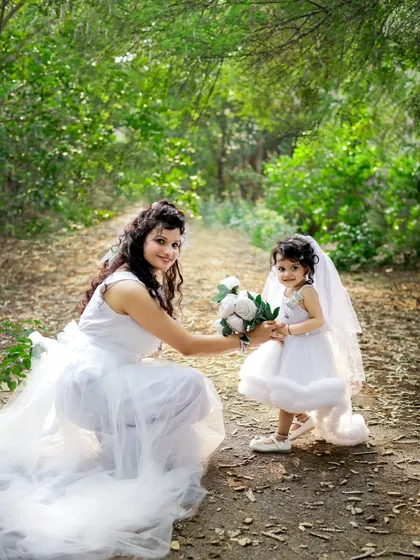 A beautiful moment between a mother and her beti during her second birthday shoot. Dressed like little angels in our garden, this photo shows the special bond they share. We have outfits like these available at our studio.