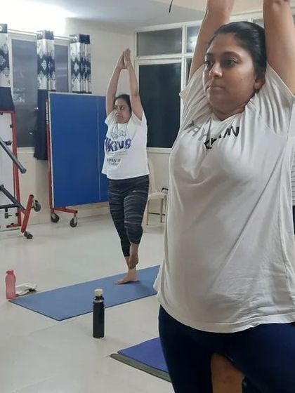 Students holding Vrikshasana (Tree Pose) during our International Yoga Day celebration. This balancing pose helps improve focus and concentration.