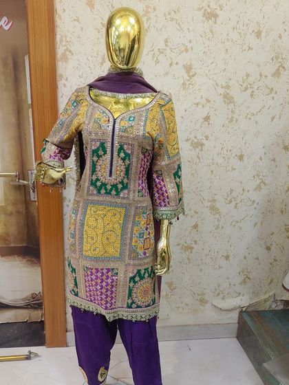 Another angle of the beautiful multi-colored embroidered suit. The craftsmanship and colors are just stunning.