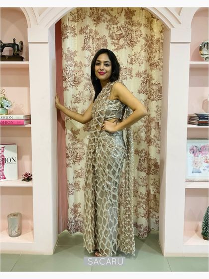 Our client Megha pictured in our signature draped saree dress in sequinned tulle, a pre-draped skirt with an attached pallu and a bandeau top.