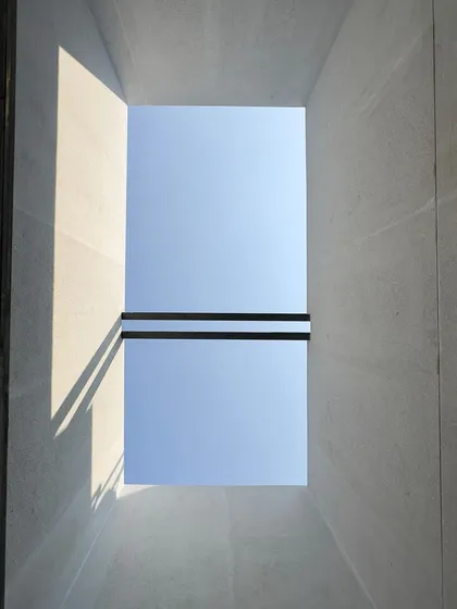 Forming with light. A simple opening to the sky in a building under construction becomes a device for drawing, casting sharp shadows that define the raw concrete space. This is architecture in its most elemental form.