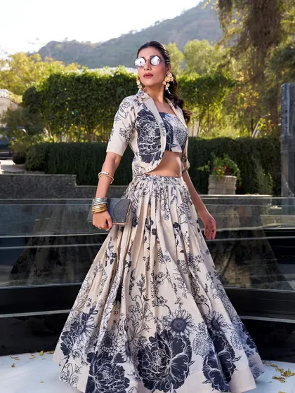 For a modern vibe with a traditional touch, I created this Tussar silk floral print lehenga. The jacket gives it a chic, Indo-Western feel, perfect for a brunch or a destination wedding event. It's elegance with a bit of an edge.