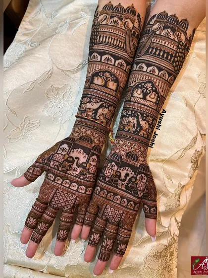 You don't always need figures to make a statement. This is a perfect example of a full, intricate bridal mehendi that is rich with traditional motifs like palaces, peacocks, and elephants, but without any human figures.