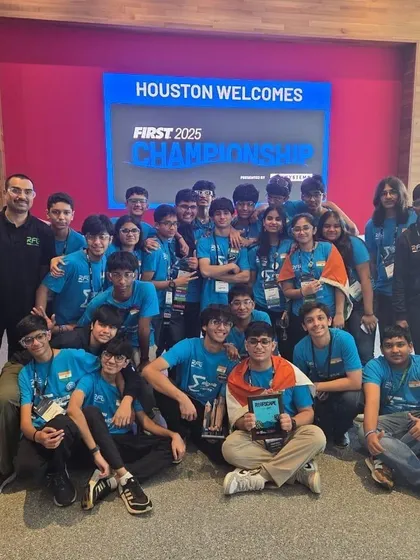 The entire Team Sigma celebrates their success at the FIRST 2025 Championship in Houston. This group photo captures the culmination of their hard work, which earned them a top spot among global competitors.