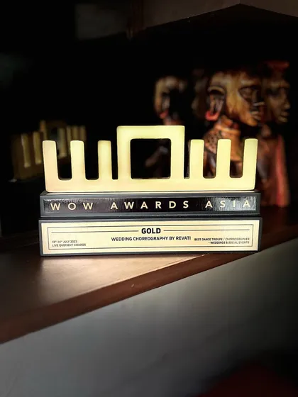 Our WOW Awards Asia trophy sitting proudly on the shelf. This award is a reminder of all the amazing weddings we've been a part of and motivates us to keep bringing more energy and fun.