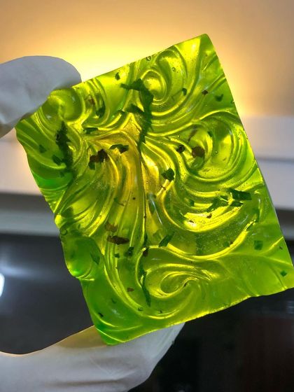 Another look at a custom "Hydration Station" soap bar. The swirls and embedded herbs show how each handmade piece is unique.