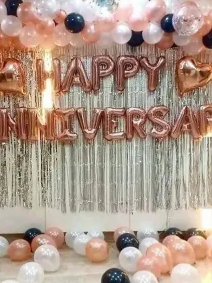 Celebrating another year together? Our anniversary decorations are all about elegance. This setup uses a trendy rose gold color scheme with a "Happy Anniversary" foil balloon banner against a shimmering silver fringe backdrop, creating a beautiful and celebratory atmosphere.