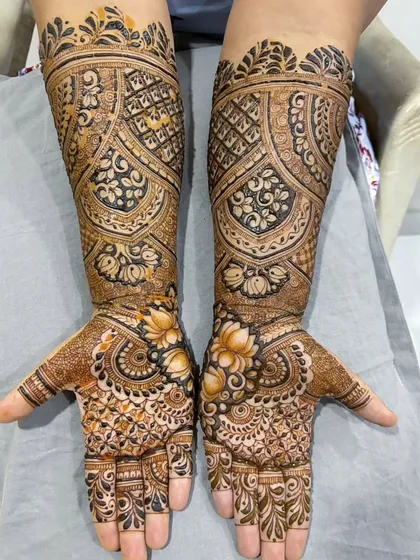 I love the challenge of a full, dense bridal design. This piece is packed with gorgeous floral and lotus motifs, covering the hands and extending up the forearms for a truly regal and elegant bridal look.