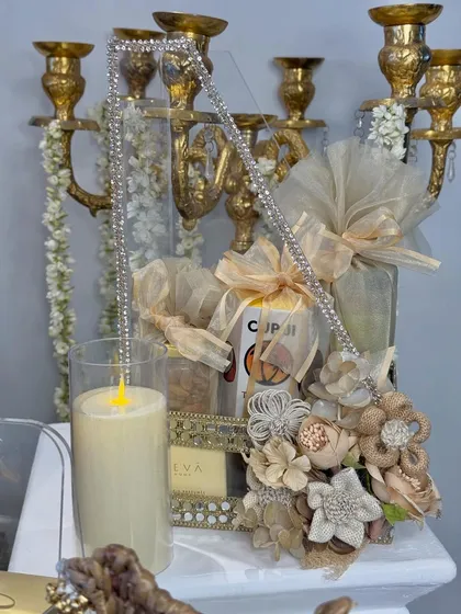 A close-up on a crystal-studded handle and jute floral embellishments, showcasing the high-quality, handcrafted details of my festive work.