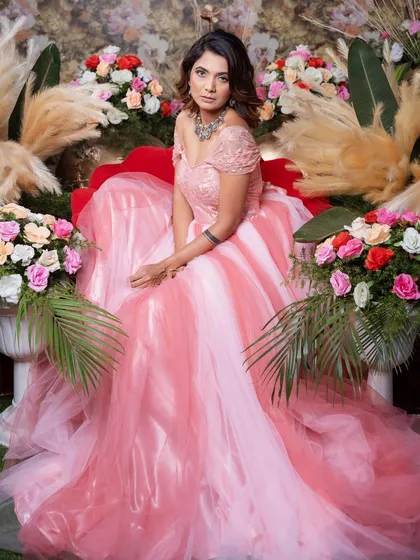 Make your fairytale moment happen with this stunning pink princess ball gown. Its voluminous layered skirt and delicate off-shoulder bodice are ideal for a grand reception or a pre-wedding shoot with a regal theme.