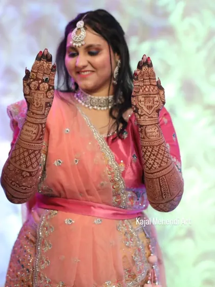 A candid shot of a happy bride showing off her beautiful mehndi. Seeing this joy is the best part of my job. Her hands are filled with dreams, ready for a new beginning.