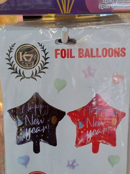 Star-shaped 'Happy New Year' foil balloons. These are a great addition to any balloon bouquet or can be used on their own to decorate your party space.