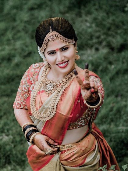 A fun and happy shot of the bride. The long-lasting makeup ensures she looks just as fresh and vibrant hours into the ceremony as she did at the beginning.