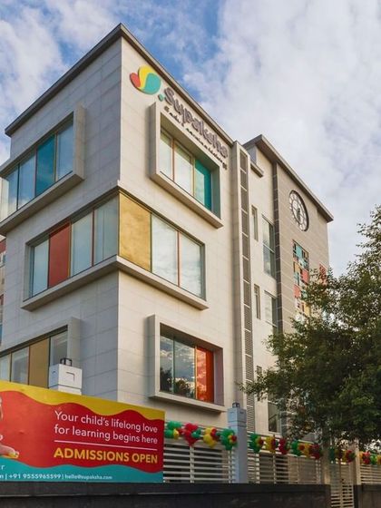 The Supaksha Early Learning Habitat, a project designed to be an interactive and nature-centric space for young children. The facade features playful colors and forms to create a welcoming environment.