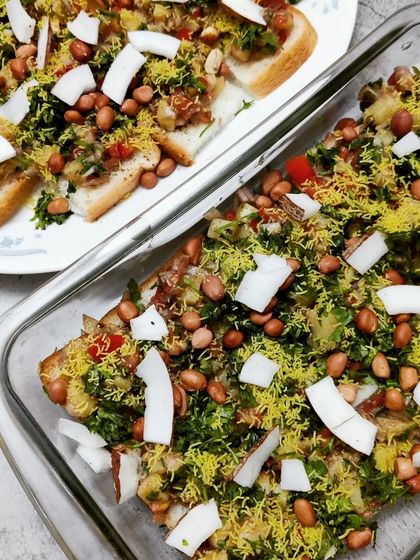 A creative twist on a classic, this is our bread chaat. Toasted bread slices are topped with a mix of potatoes, onions, peanuts, sev, and fresh coconut, creating a crunchy and flavourful snack.