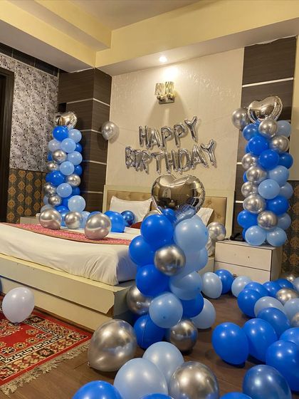 Another close-up of the blue and silver birthday room setup.