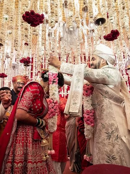 The groom's turn. A fun and playful moment during the varmala ceremony.