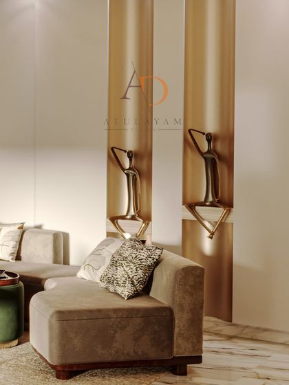 A close-up of the sculptural wall art and the plush taupe sectional sofa, highlighting the blend of textures and materials.