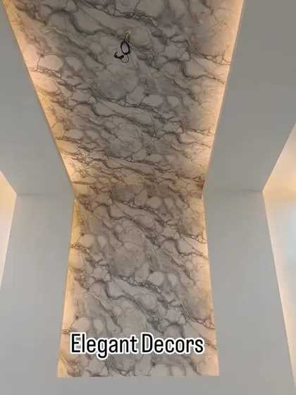 Don't just think about walls, look up. This ceiling was transformed using a single piece of our grey UV marble sheet, creating a dramatic and luxurious effect. It's a great way to make any room feel grand and is completely waterproof.